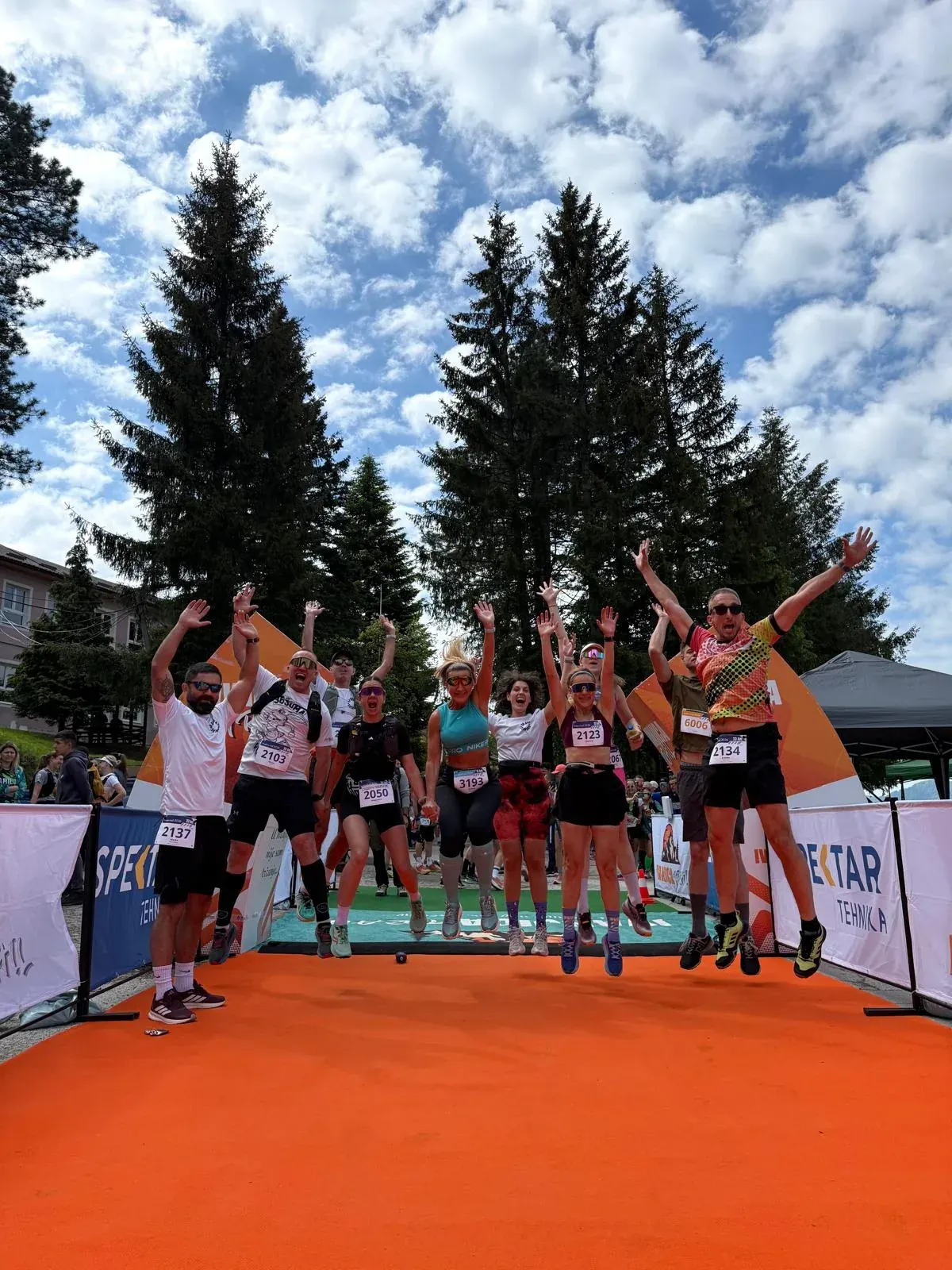 Runners celebrating at the finish line in Ivanjica